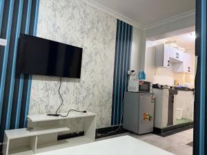 a living room with a flat screen tv on the wall at 1 Bed in Thika cbd in Thika