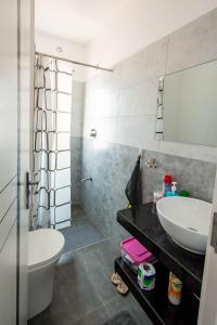 a bathroom with a sink and a toilet at BethelHomes in Tatu City