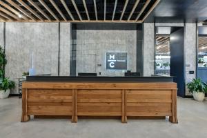 a reception desk in a lobby with plants at Central Sq 1BR w Gym DM nr Central Sq T BOS-256 in Cambridge