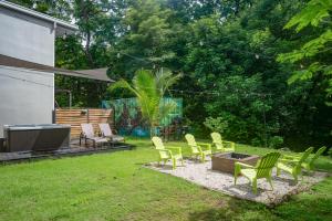 a group of chairs and a fire pit in a yard at Monte Donato 17 in Playa Avellana