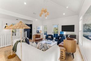 a living room with a couch and a table at The Last Waltz in Seacrest