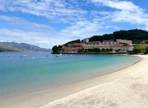 a view of a beach with boats in the water at Casa MAR DE GAIA Corcubión in Corcubión