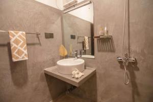 a bathroom with a sink and a mirror at A peaceful villa for recuperation in Ahangama