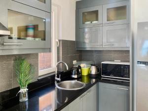 a kitchen with a sink and a microwave at Urai Villa by Utalay Koh Chang in Ban Khlong Son +64 photos