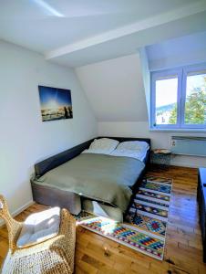 a bedroom with a bed in the corner of a room at Kopaonička priča in Kopaonik