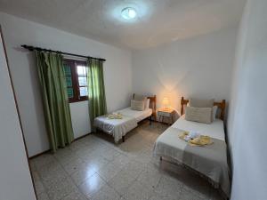 a room with two beds and a window at Vista Paraiso in Tías
