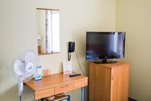 TV a/nebo společenská místnost v ubytování Hotel Yes