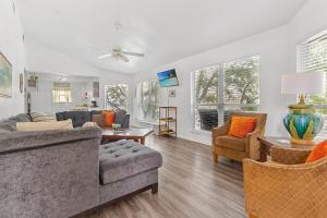 a living room with a couch and chairs and a table at Earth Haus LITE in Fourth Crossing