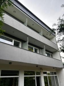 a building with balconies on the side of it at Wald Hotel in Kirschweiler