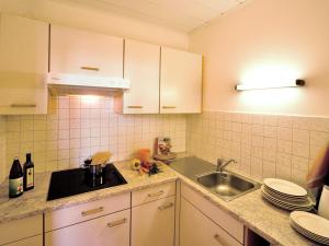 Kuchyň nebo kuchyňský kout v ubytování Appartements Erika