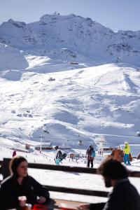 a group of people on a snow covered mountain at Le Val Thorens, a Beaumier hotel in Val Thorens