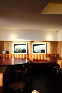 a dining room with a table and chairs at Le Val Thorens, a Beaumier hotel in Val Thorens +155 photos