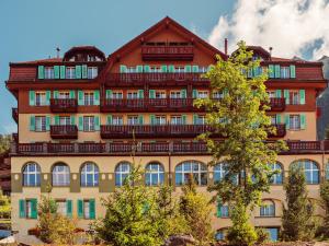 a large building with balconies on the side of it at Grand Hotel Belvedere, a Beaumier Hotel in Wengen