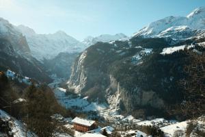 a view of a mountain valley with snow covered mountains at Grand Hotel Belvedere, a Beaumier Hotel in Wengen