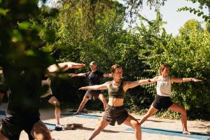 a group of young people dancing in a park at Le Galinier Lourmarin, a Beaumier Guesthouse in Lourmarin +66 photos