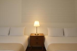 Giường trong phòng chung tại Seoul Station 5min Walk Elevator Free Parking