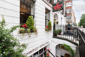 a building with flowers on the side of it at St Athans Hotel in London