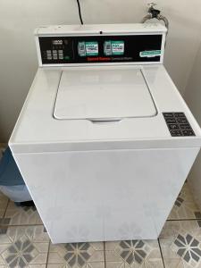 a white counter top with a white drawer at Tropical Beach Second Floor Studio With Hill View in Coco