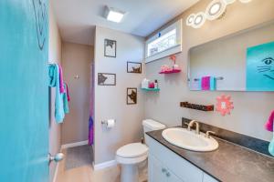 a bathroom with a sink and a toilet at Galactikitty - Quirky Cabin Near Lake Brownwood! in Lake Brownwood +18 photos