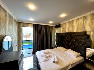 Ένα ή περισσότερα κρεβάτια σε δωμάτιο στο Panorama of the Mountains +29 φωτογραφίες