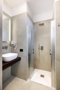 a bathroom with a shower and a sink at Harmonia B&B in Aversa +34 photos