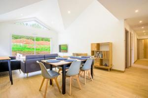 a dining room with a table and chairs at Ma Bonne Etoile in Anould