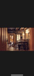 a dining room with a table and chairs at Apartamentos Rurales La Plaza in Cabezuela del Valle