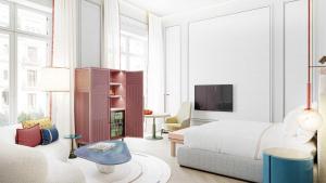 a bedroom with a bed and a living room at Áurea Palacio de la Tinta in Málaga +25 photos