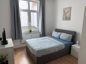 Ένα ή περισσότερα κρεβάτια σε δωμάτιο στο Vacation home in Bremerhaven