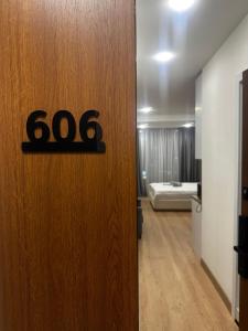 a door with a sign on it in a room at La Vita Batumi in Batumi