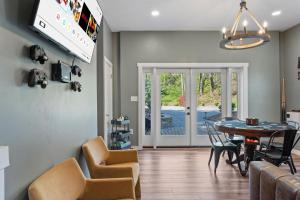 a kitchen and dining room with a table and chairs at 1910 Asheville Gem in Fairview