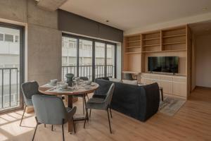 a living room with a table and a couch at Second Home Juárez 56 in Mexico City