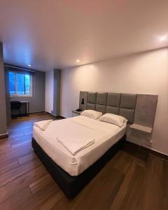 Katil atau katil-katil dalam bilik di Residencial & Hotel Palazzo