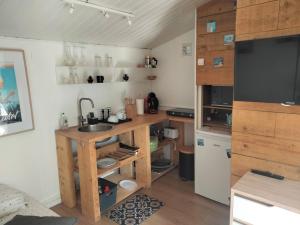 a small kitchen with a sink and a counter at Chalet Nanou in La Ciotat