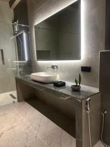 a bathroom with a sink and a large mirror at Secret House in Dickwella +255 photos