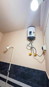 a room with a bucket on the corner of a wall at Royal Palace in Dibrugarh +33 photos