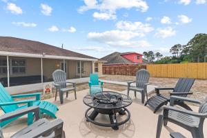 a group of chairs and a table on a patio at Life is Good! in Port Saint Lucie