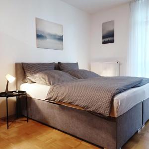 a bedroom with a large bed in a room at TauberNest in Bad Mergentheim