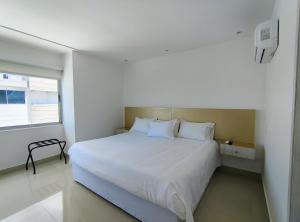 Postel nebo postele na pokoji v ubytování Apartamentos Amoblados- Buenavista Barranquilla
