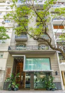 a building with plants in front of it at Mio Buenos Aires in Buenos Aires
