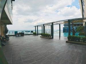 a balcony of a building with a view of the ocean at TM Persiaran Stonor BY PANORAMA in Kuala Lumpur +57 photos