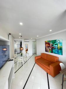 a living room with a couch and a table at Loft in Cartagena with direct beach access in Cartagena de Indias