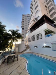 a swimming pool in front of a building at Loft in Cartagena with direct beach access in Cartagena de Indias