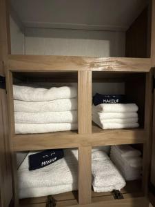 a wooden towel rack with towels in a bathroom at Prairie Dog Perch Tiny Home in Interior