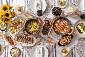 a table with plates of food on a table at NH Collection Buenos Aires Centro Histórico in Buenos Aires