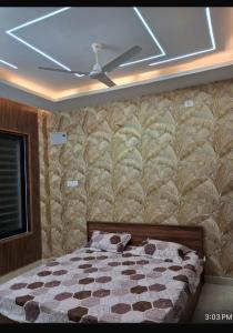 a bedroom with a bed and a ceiling at YR Heights Home Stay in Hyderabad