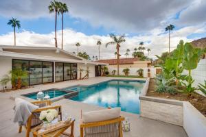 a swimming pool in the backyard of a house at 55 and Indian Wells Retreat Private Pool and Spa! in Indian Wells