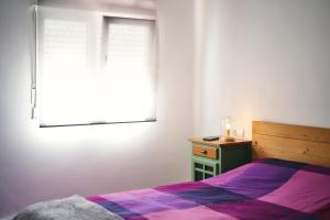 En eller flere senge i et værelse på La Casita de Helen