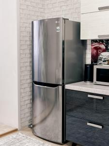 Kuchyň nebo kuchyňský kout v ubytování Евродвушка в ЖК Ирина