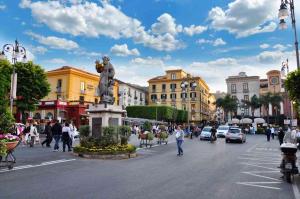 a city street with a statue in the middle at Relais holiday in Sorrento
